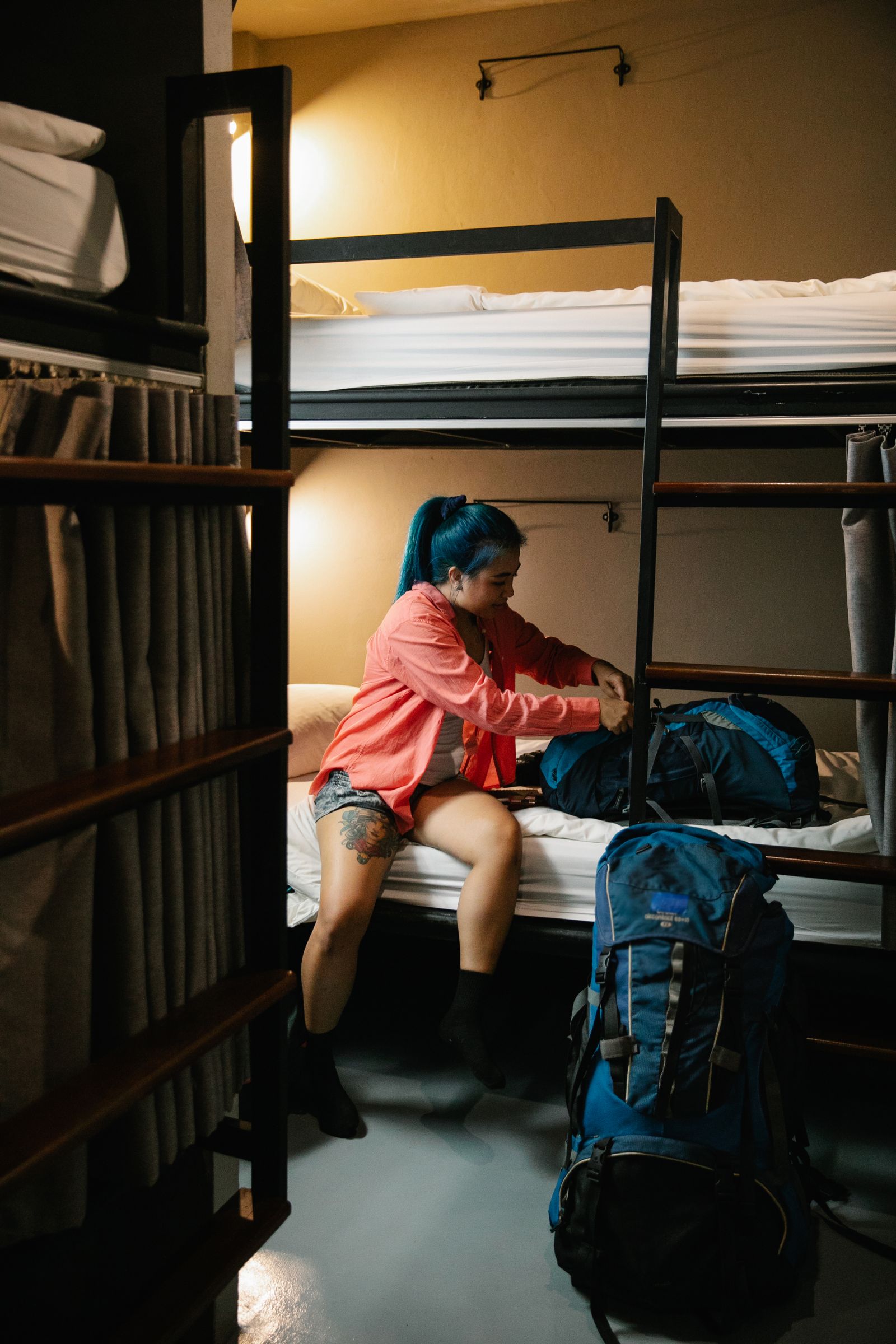 Traveller packing a backpack, ready to travel on a budget across Europe